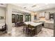 Well-lit kitchen showcasing an island with a sink, bar seating, and modern fixtures at 1200 Dry Point Ct, Las Vegas, NV 89144