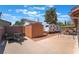 Expansive backyard featuring a utility shed, recreational parking, and shaded seating area at 1534 Irene Dr, Boulder City, NV 89005