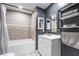 Bathroom showcasing a tub with shower, updated vanity, and modern decor at 1534 Irene Dr, Boulder City, NV 89005