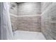 Close up on tiled bathtub with shower head and curtain rod at 1534 Irene Dr, Boulder City, NV 89005