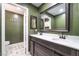 Elegant bathroom with dual sinks, dark wood cabinetry, and modern fixtures at 1534 Irene Dr, Boulder City, NV 89005