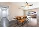 Spacious dining room area with wood flooring and large wood picnic table for entertaining at 1534 Irene Dr, Boulder City, NV 89005