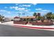 Charming single-story home with a well-maintained lawn, and palm trees, perfect curb appeal at 1534 Irene Dr, Boulder City, NV 89005