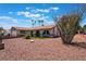 Beautiful desert landscaped front yard, features a nice green lawn and shrubbery at 1534 Irene Dr, Boulder City, NV 89005