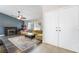 Inviting living room featuring a cozy fireplace, plush sofa, and stylish decor at 1534 Irene Dr, Boulder City, NV 89005