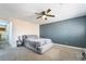 Cozy primary bedroom with carpeted floors, ceiling fan, and calming color palette at 1534 Irene Dr, Boulder City, NV 89005