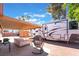 Enjoy outdoor living with this shaded patio, comfortable seating, and additional recreational vehicle parking at 1534 Irene Dr, Boulder City, NV 89005