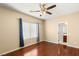 Comfortable bedroom offers a ceiling fan, ensuite bathroom, and a window at 17 Morninglow Pass, Henderson, NV 89052