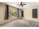 Bedroom with large window offering natural light and a ceiling fan at 17 Morninglow Pass, Henderson, NV 89052