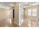 Versatile bonus room featuring french doors, ample natural light, and neutral color palette at 17 Morninglow Pass, Henderson, NV 89052