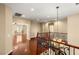Foyer with hardwood floors, railing and staircase at 17 Morninglow Pass, Henderson, NV 89052
