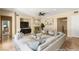 Staged living room featuring a fireplace, neutral tones, ample seating, and contemporary decor at 17 Morninglow Pass, Henderson, NV 89052