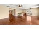 Expansive living area featuring hardwood floors, high ceilings, and a wet bar at 17 Morninglow Pass, Henderson, NV 89052