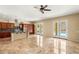 Bright open-concept living area with fireplace and kitchen with access to the outdoor pool at 17 Morninglow Pass, Henderson, NV 89052