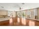 Spacious living room with hardwood floors, recessed lighting, and access to balcony at 17 Morninglow Pass, Henderson, NV 89052