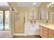 Bathroom features double sinks, a shower, tub and direct access to the backyard at 1931 Jasper Creek Pl, Las Vegas, NV 89123