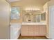 Bright bathroom featuring a double sink vanity and tub, providing ample space and functionality at 1931 Jasper Creek Pl, Las Vegas, NV 89123