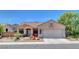 Charming single-story home with a well-manicured front yard and a two-car garage at 1931 Jasper Creek Pl, Las Vegas, NV 89123