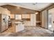 Spacious kitchen with stainless appliances, granite counters, and sliding glass doors at 1931 Jasper Creek Pl, Las Vegas, NV 89123