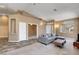 Inviting living space with a comfortable gray sectional sofa and lots of natural light at 1931 Jasper Creek Pl, Las Vegas, NV 89123
