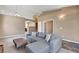 Open living room featuring neutral paint, a stylish sofa and modern lighting at 1931 Jasper Creek Pl, Las Vegas, NV 89123
