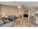Comfortable living room featuring tile flooring, fireplace, and neutral colors at 1931 Jasper Creek Pl, Las Vegas, NV 89123