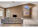 Bright living room with vaulted ceilings, abundant natural light, and a stylish sectional sofa at 1931 Jasper Creek Pl, Las Vegas, NV 89123