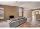 Bright living room with abundant natural light and a comfortable sectional sofa at 1931 Jasper Creek Pl, Las Vegas, NV 89123