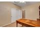 Home office space with a built-in desk and closet space, creating a dedicated and organized workspace at 1931 Jasper Creek Pl, Las Vegas, NV 89123
