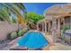 Inviting backyard pool with covered patio, perfect for outdoor living and entertaining in a private setting at 1931 Jasper Creek Pl, Las Vegas, NV 89123