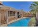 Sparkling backyard pool with covered patio, offering a serene retreat and plenty of space for outdoor recreation at 1931 Jasper Creek Pl, Las Vegas, NV 89123