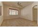 Relaxing bedroom with tile flooring, a ceiling fan, and a window offering natural light at 1945 Trail Peak Ln, Las Vegas, NV 89134