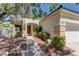 Beautiful single-story home with a two-car garage, desert landscaping and a covered front entryway at 1945 Trail Peak Ln, Las Vegas, NV 89134