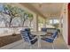 Inviting covered patio featuring a table, four chairs, and a ceiling fan for relaxed outdoor living at 1945 Trail Peak Ln, Las Vegas, NV 89134