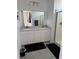 Bathroom features a double vanity and a glass-enclosed shower at 219 Vanhoy Ave, Henderson, NV 89011
