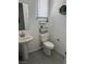 Well-lit half bath features white fixtures and neutral decor at 219 Vanhoy Ave, Henderson, NV 89011