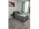 Cozy bedroom featuring plush carpeting, neutral tones, and natural light from the window at 219 Vanhoy Ave, Henderson, NV 89011