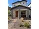 Charming home with a cozy front porch and desert landscaping offers curb appeal at 219 Vanhoy Ave, Henderson, NV 89011