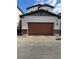 Spacious two-car garage with a decorative brick accents offers parking and storage at 219 Vanhoy Ave, Henderson, NV 89011
