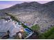 A desert home featuring a pool and desert landscaping nestled against a stunning mountain backdrop in a serene setting at 2369 Green Mountain Ct, Las Vegas, NV 89135