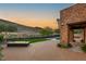 Backyard with a modern fire pit, pool, and mountain views, offering a serene outdoor living and entertainment space at 2369 Green Mountain Ct, Las Vegas, NV 89135