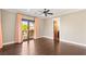 Large bedroom with hardwood floors, access to a private balcony, and plenty of natural light at 2369 Green Mountain Ct, Las Vegas, NV 89135