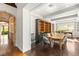 Dining room with natural light, built-in shelves, dark wood floors, and seamless transition to an outdoor space at 2369 Green Mountain Ct, Las Vegas, NV 89135