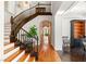 Hallway and stairway with beautiful hardwood floors and detailed millwork at 2369 Green Mountain Ct, Las Vegas, NV 89135