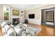 Cozy living room features a fireplace, mounted television, and comfortable seating, creating an inviting atmosphere at 2369 Green Mountain Ct, Las Vegas, NV 89135
