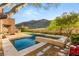 Inviting swimming pool with mountain views, desert landscaping and an adjacent lounging area at 2369 Green Mountain Ct, Las Vegas, NV 89135
