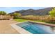 Backyard showcasing a refreshing pool, artificial lawn, and mountain views, perfect for outdoor relaxation and entertainment at 2369 Green Mountain Ct, Las Vegas, NV 89135