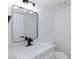 Chic bathroom with marble countertop, modern black faucet and framed mirror, complemented by a sleek white toilet at 2405 Pickwick Dr # 55, Henderson, NV 89014