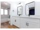 Modern bathroom featuring double sinks, updated cabinets, and stylish black hardware at 2405 Pickwick Dr # 55, Henderson, NV 89014