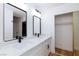 Contemporary bathroom equipped with double sinks, vanity and closet at 2405 Pickwick Dr # 55, Henderson, NV 89014